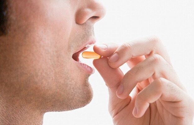 A man taking a complex of vitamins to maintain potency